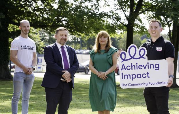 Health Minister Robin Swann is joined by Roisin Wood, Chief Executive, Community Foundation, and Simon Darby and Lee Sheridan from Young Lives vs Cancer,  one if the groups receiving monies to provide a wide range of support services for cancer 